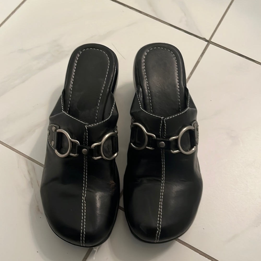 Black leather clogs